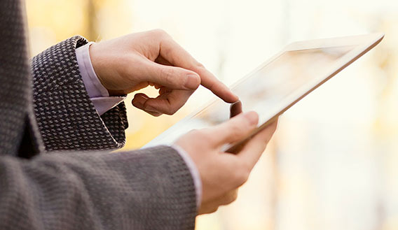Photo of person using a tablet device