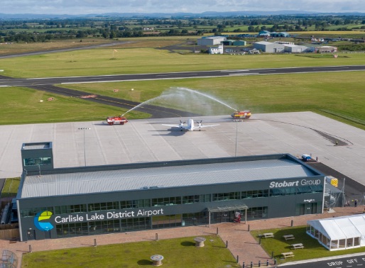 Aerial photograph of Carlisle Airport, with runway and countryside visible in the distance