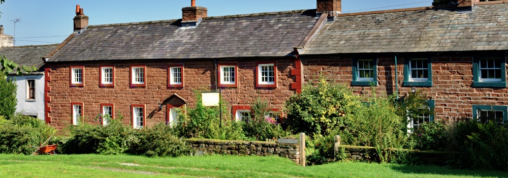 Photo of a row of small cottage houses