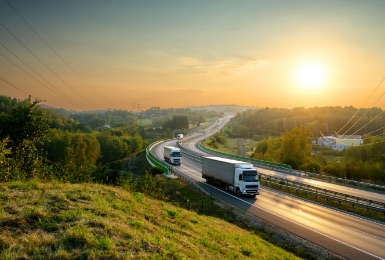 Photo of lorries travelling goods on a motorway